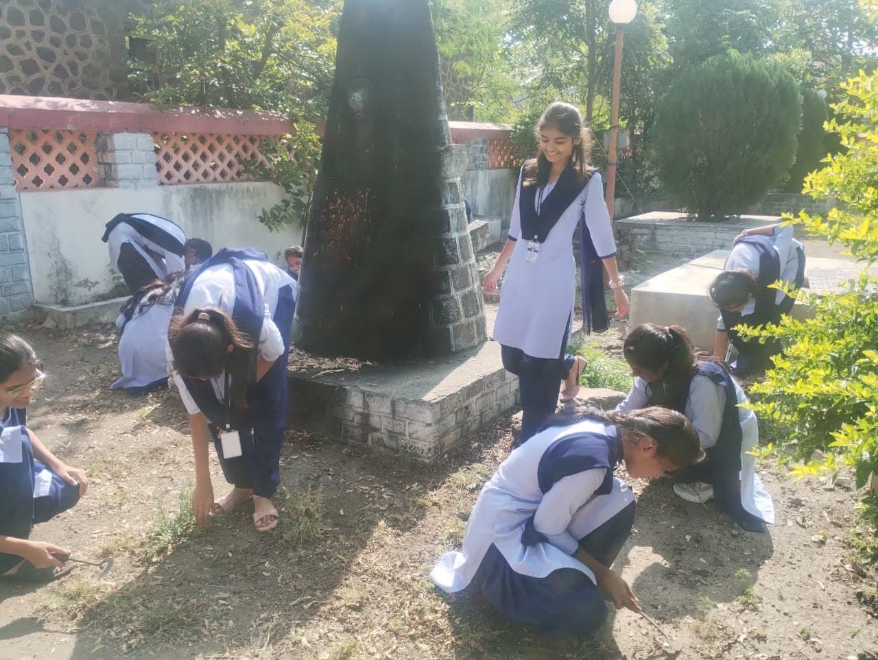 Students taking part in a campus cleanliness drive