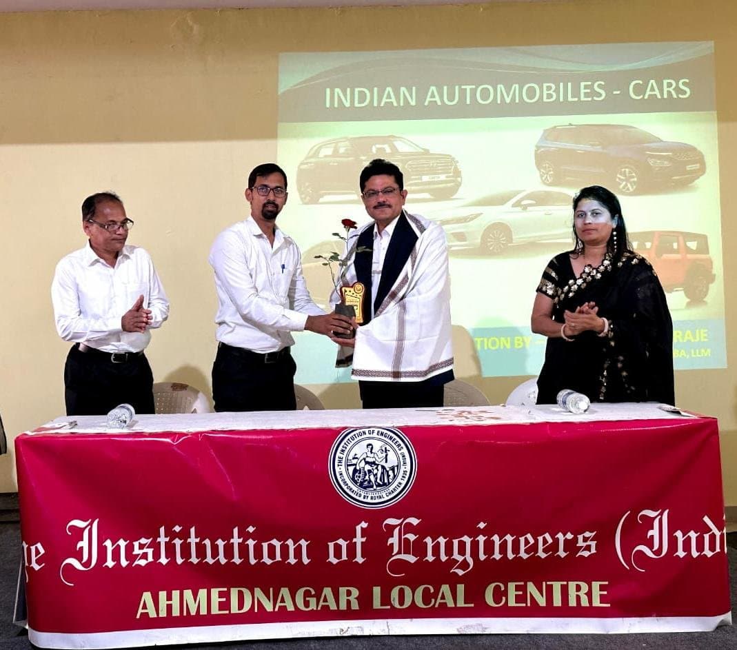 Guest speaker felicitated at an Institution of Engineers (India) lecture on Indian automobiles