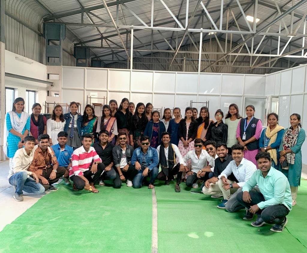Students and faculty at an event hall