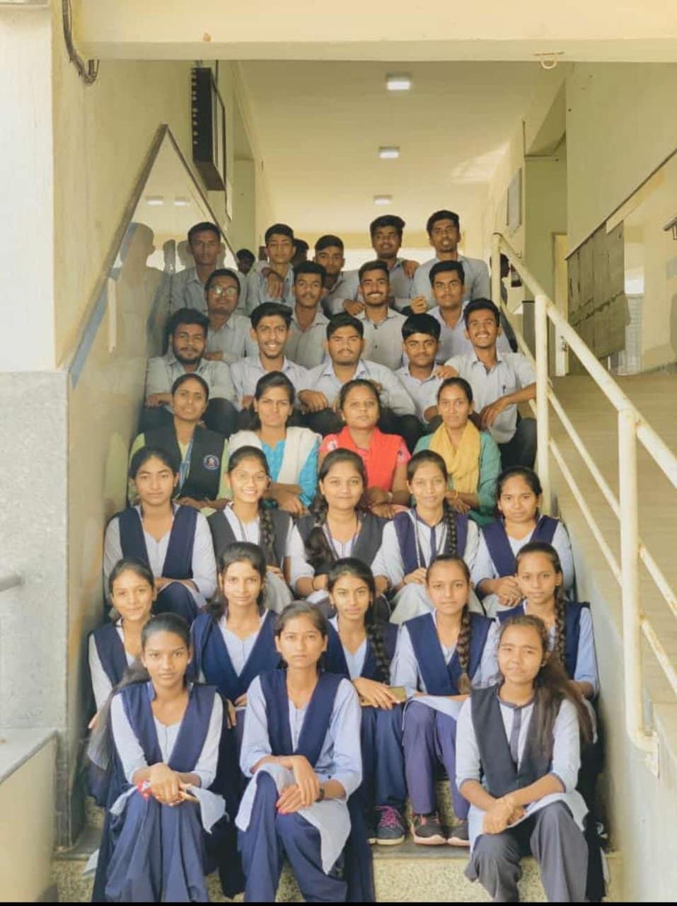 Students group photo on the college staircase