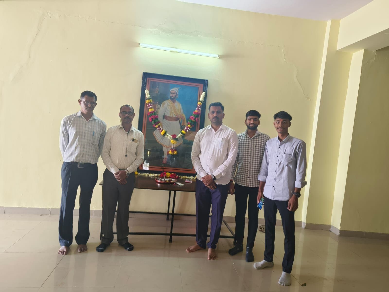 Faculty and students paying tribute to Chhatrapati Shivaji Maharaj