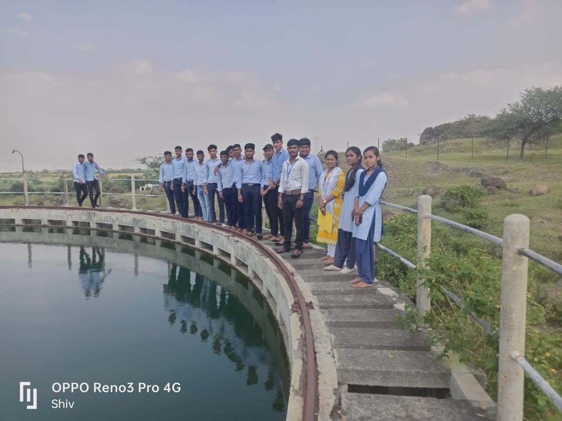 Students on the clarifier tank during a water treatment plant visit