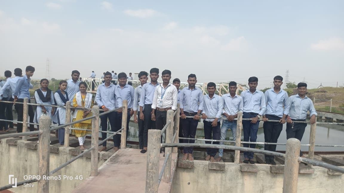 Students beside the filter beds at the water treatment plant